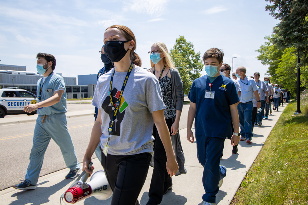 Jenna Koelsch walking on the NCRC campus with participants.