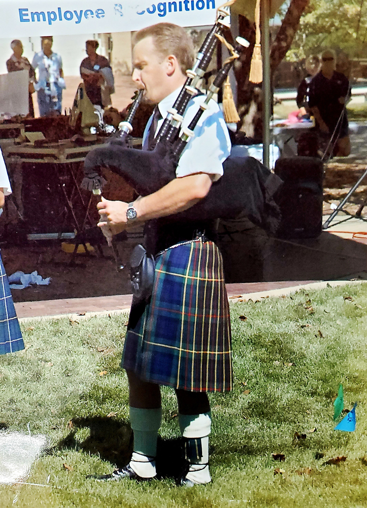 Dr. Scott Owens playing bagpipes at a Michigan Medicine Talent Fair when he was a GI Fellow.