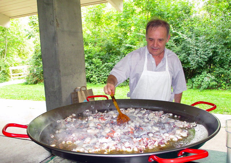 Dr. Núñez preparing paella.