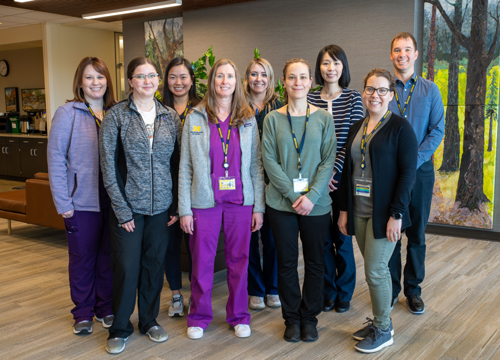 Dr. Chan (third from right) and Steve Hrycaj (first from right) with their team.