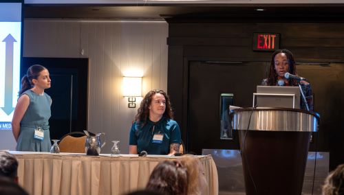 Dr. Allecia Wilson presents as Alexis Snyder and Jessica Hagen look on.