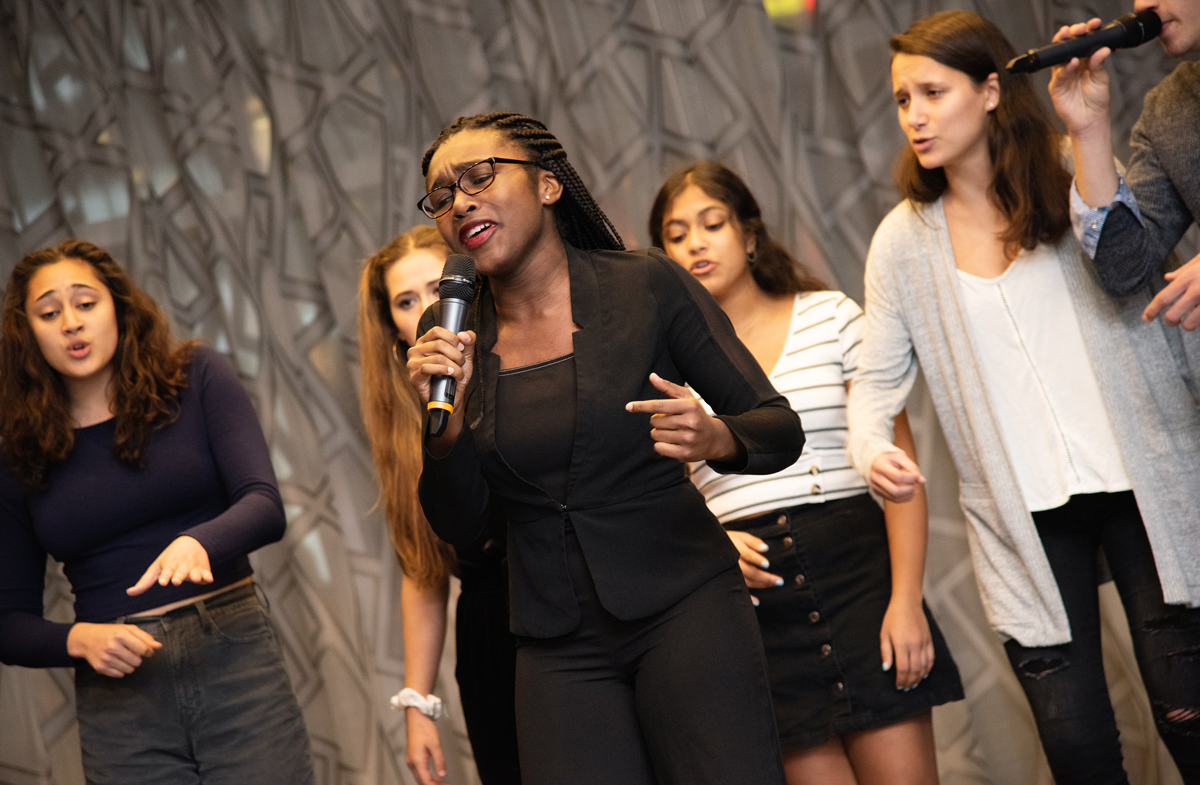 The University of Michigan a cappella group, Amaizin’ Blue performed for attendees during Friday night's reception dinner.